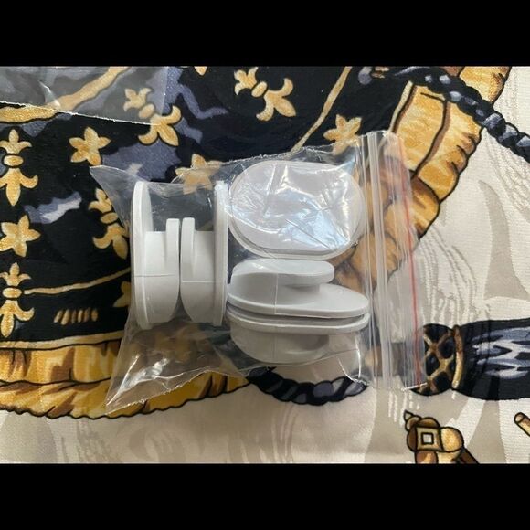 Cell phone rings & hooks bundle. Comes with several stick ons for hangers. - Picture 2 of 4